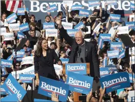  ?? MARY ALTAFFER — THE ASSOCIATED PRESS ?? Democratic presidenti­al candidate Sen. Bernie Sanders, I-VT., right, is introduced by Rep. Alexandria Ocasio-cortez, D-N.Y., during a campaign rally Saturday in New York.