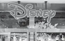  ?? Joe Raedle / Getty Images ?? The Walt Disney Co.’s chain of stores debuted in 1987, and they were once a staple of shopping malls in the United States.