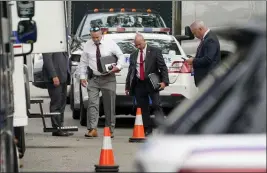  ?? JOHN MINCHILLO — THE ASSOCIATED PRESS FILE ?? Authoritie­s search the Massapequa Park home of suspect Rex Heuermann on Tuesday,