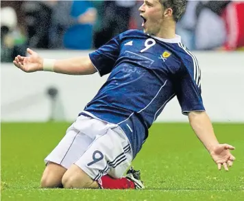  ??  ?? Chris Maguire celebrates his sensationa­l strike at Easter Road in 2010