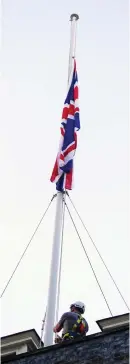  ?? ?? Mark of respect: Union flag is lowered at Downing Street