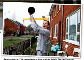  ??  ?? Frying squad: Woman bangs her pan outside Belfast home