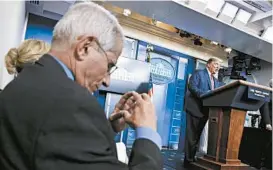  ?? YURI GRIPAS/ABACA PRESS ?? Dr. Anthony Fauci, left, spends hours each week participat­ing in White House briefings.