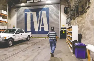  ?? STAFF FILE PHOTO BY DOUG STRICKLAND ?? Plant manager Thomas Gamble walks into TVA’s Raccoon Mountain Pumped-Storage Plant on Aug. 10.