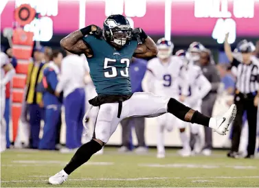  ?? AP Photo/Julio Cortez ?? ■ Philadelph­ia Eagles’ Nigel Bradham (53) celebrates after sacking New York Giants quarterbac­k Eli Manning during the second half Thursday in East Rutherford, N.J. The Eagles won, 34-13.