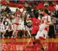  ?? DAVID TURBEN — FOR THE NEWS-HERALD ?? Matt Sabin shoots from 3-point range during Mentor’s win over Elyria on Feb. 22.