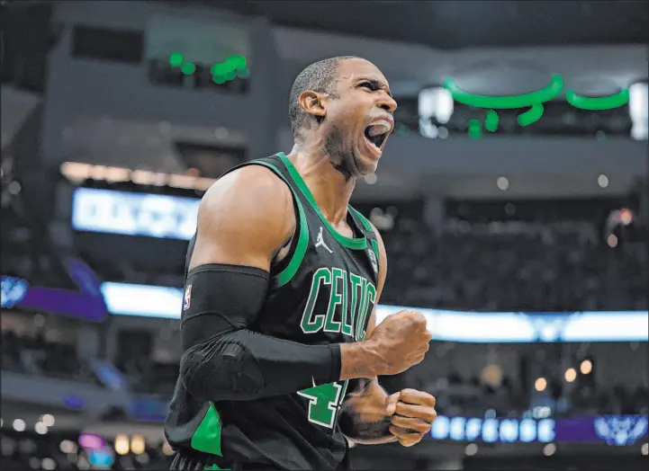  ?? Morry Gash The Associated Press ?? Boston’s Al Horford scored a career playoff high 30 points Monday night to help the Celtics pull even in their series with the defending champion Milwaukee Bucks.