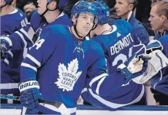  ?? FRANK GUNN THE CANADIAN PRESS ?? Maple Leafs centre Auston Matthews celebrates his goal at the bench against the Anaheim Ducks in Toronto on Monday night. Matthews had two goals and an assist and was a plus-five in the 7-4 Toronto victory.