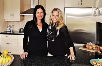  ?? The Canadian Press ?? Ottawa hockey moms Korey Kealey (left), a culinary expert and recipe developer, and Erin Phillips, nutritioni­st and wife of Chris Phillips of the NHL's Ottawa Senators, pooled their resources to write "The Ultimate Cookbook for Hockey Families."