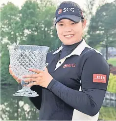  ??  ?? Ariya holds the championsh­ip trophy after winning the Kingsmill Championsh­ip presented by Geico on the River Course at Kingsmill Resort in Williamsbu­rg, Virginia. — AFP photo