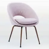  ?? WEST ELM ?? West Elm’s Orb upholstere­d dining chair comes in a Dusty Blush fabric (US$249, westelm. com).