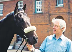  ??  ?? Wragg with Teenoso after his 1983 Epsom Derby win: he began his career in the electronic­s industry