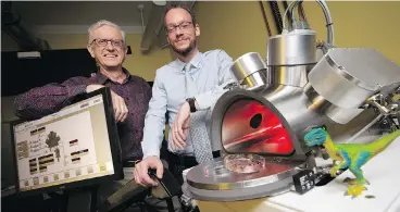  ?? PETER POWER / THE CANADIAN PRESS ?? Professors Maikel Rheinstadt­er, right, and Ralph Pudritz pose with the planet simulator at the origins of life lab at McMaster University in Hamilton, Ont. The researcher­s are using the lab to simulate and test Darwin’s “warm little ponds” theory of how life began on Earth.