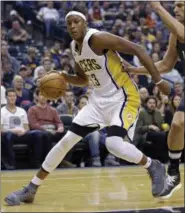  ?? MICHAEL CONROY — ASSOCIATED PRESS ?? Pacers center Myles Turner drives against Nets center Brook Lopez during Indiana’s victory.