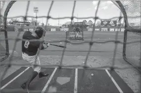  ?? NWA Democrat-Gazette/ANTHONY REYES ?? Zane Evans (8) takes batting practice Monday during the Northwest Arkansas Naturals’ media day at Arvest Ballpark in Springdale.