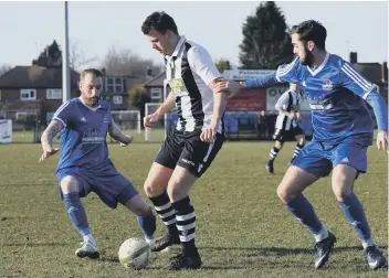  ??  ?? James Hill-Seekings (stripes) on the ball for Peterborou­gh Northern Star against Yaxley.