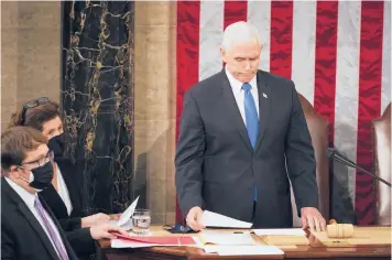  ?? JIM LO SCALZO/AP ?? Vice President Mike Pence officiates as a joint session of Congress convenes to confirm the Electoral College votes cast in November and formally declare President-elect Joe Biden’s victory over President Donald Trump.