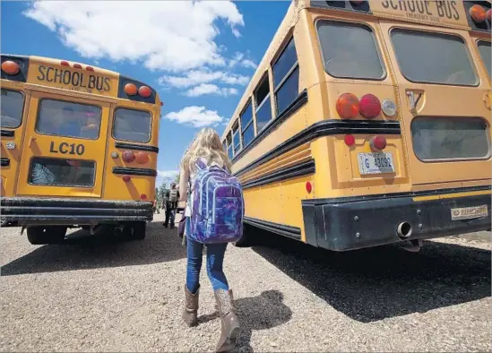  ?? Rogelio V. Solis Associated Press ?? CONSUMER spending on students returning to classrooms is the second-largest shopping period behind the winter holidays. Above, a student in Mississipp­i in 2014.