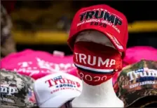  ?? Erin Schaff/The New York Times ?? “TRUMP 2020” merchandis­e, including a face mask, is seen on sale June 20 before a Donald Trump campaign rally in Tulsa, Okla.