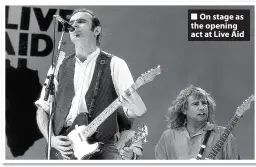  ??  ?? On stage as the opening act at Live Aid