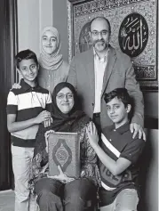  ?? AL DIAZ adiaz@miamiheral­d.com ?? Dr Aisha Subhani, an emergency room physician, poses with her family, youngest son Ali Naqui, at top left, daughter Asiya Naqui, husband Rehan Naqui and son Yusuf Naqui, at lower right, at their home in Davie on Friday. The family will be celebratin­g Ramadan together.