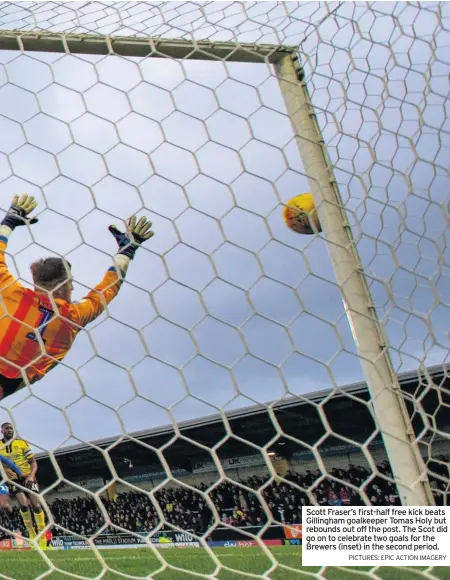  ?? PICTURES: EPIC ACTION IMAGERY ?? Scott Fraser’s first-half free kick beats Gillingham goalkeeper Tomas Holy but rebounds out off the post. The Scot did go on to celebrate two goals for the Brewers (inset) in the second period.