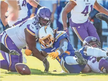  ?? TNS ?? Los Angeles Chargers running back Melvin Gordon loses one of his two fumbles against the Minnesota Vikings.