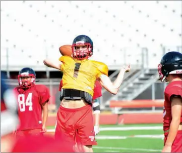  ?? WILLIAM HARVEY/THREE RIVERS EDITION ?? Russellvil­le junior Rhett Adkins attempts a pass during practice.