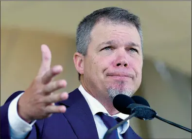  ?? AP/HANS PENNICK ?? Chipper Jones, one of six players inducted into the MLB Hall of Fame on Sunday, speaks during the induction ceremony at the Clark Sports Center in Cooperstow­n, N.Y. Jones kept his emotions in check as a crowd estimated at 50,000 took in the festivitie­s.