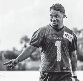  ?? Courtesy of Miami Dolphins ?? Dolphins first-round pick Tua Tagovailoa went through a full-team practice Wednesday for the first time as a pro. ‘Realistic expectatio­ns for Tua should be very low,’ ESPN analyst Dan Orlovsky said of Miami’s rookie quarterbac­k.