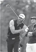  ?? DANIELLE PARHIZKARA­N/USA TODAY SPORTS ?? Dustin Johnson follows a shot during the second round of the U.S. Open on Sept. 18 at Winged Foot Golf Club.