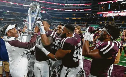  ?? Tony Gutierrez / Associated Press ?? A victory over No. 1 Alabama this weekend would put Texas A&M coach Kevin Sumlin in position to lift much more important hardware than the Southwest Classic trophy the Aggies won after beating Arkansas on Sept. 24 in Arlington.