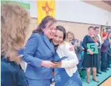  ?? EDDIE MOORE/JOURNAL ?? Secretary of Education Hanna Skandera, left, hugs Santa Fe teacher Melissa Kovac, the winner of a Milken Education Award, in November 2016. Skandera will be stepping down effective June 20.