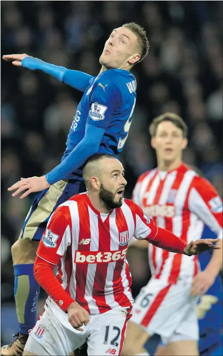  ?? — GETTY IMAGES ?? Leicester striker Jamie Vardy, left, vies with Stoke City defender Marc Wilson during their English Premier League game in Leicester Saturday. Leicester won 3-0.