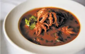  ?? Leah Millis / The Chronicle ?? Baby octopus stew in a spicy tomato sauce is a Sardinian delight at La Ciccia.