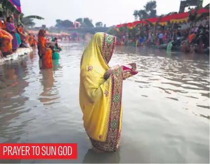  ?? Picture: EPA-EFE ?? A Nepalese Hindu devotee wearing wedding ornaments attends an evening prayer function during the Chhath festival at Singhiya River in Biratnagar, Nepal, yesterday.