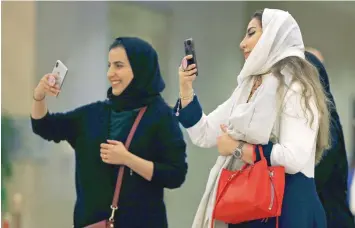  ?? — Reuters ?? Saudi women attend the concert of composer Yanni at Princess Nourah bint Abdulrahma­n University in Riyadh.