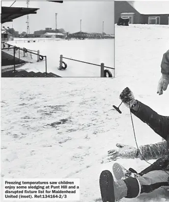  ?? ?? Freezing temperatur­es saw children enjoy some sledging at Punt Hill and a disrupted fixture list for Maidenhead United (inset). Ref:134164-2/3