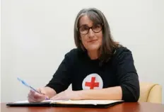  ?? Sebastian Foltz/Post-Gazette ?? Marcia Donnellan, at the Strip District office of the southweste­rn Pennsylvan­ia chapter of the Red Cross, began volunteeri­ng for the organizati­on in October.