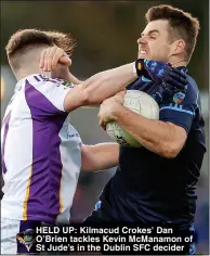  ?? ?? HELD UP: Kilmacud Crokes’ Dan O’Brien tackles Kevin McManamon of St Jude’s in the Dublin SFC decider