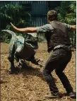  ??  ?? „ Christ Pratt was confronted by velocirapt­ors in Jurassic World.