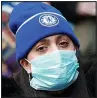  ??  ?? UNDER COVER: Fan at Chelsea yesterday