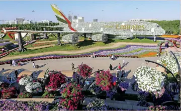  ?? AFP ?? A floral installati­on in the form of an Emirates Airbus A380 at the Dubai Miracle Garden. The emirate is aiming to promote sustainabl­e tourism destinatio­ns via its Dubai Sustainabl­e Tourism Initiative. —