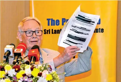  ?? ?? Lord Naseby who was in Sri Lanka this week to launch his autobiogra­phy was invited to address the Press Club of the Sri Lanka Press Institute at the Colombo Hilton on Monday. Here, he shows the audience the documents he received from the UK Freedom of Informatio­n Office replete with redactions (censoring of texts) from the dispatches sent by the Defence Attache of the British High Commission during the 2009 military operations against the LTTE. He spoke on the subject of "Freedom of Informatio­n". Pic by Indika Handuwala