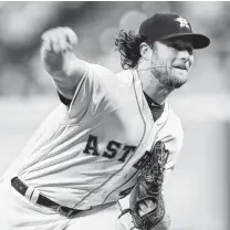  ?? Brett Coomer / Houston Chronicle ?? Astros starting pitcher Gerrit Cole pitches against the Tampa Bay Rays during the first inning.