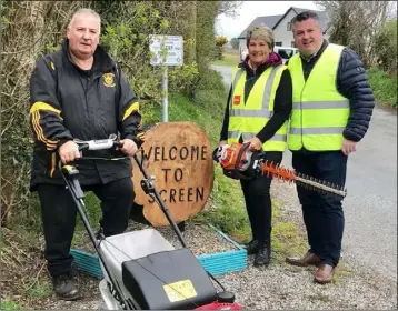  ??  ?? Mower power to them: Tony and Theresa Kehoe, with Cllr George Lawlor.