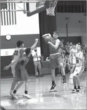  ?? Becky Finney ?? Dalton Duryea of Anselmo-Merna pulls down a rebound against Sandhills-Thedford on Jan. 14 in Dunning. After falling behind by double digits in the second quarter, A-M almost won the game thanks to the three shooting ability of Garrett Porter.