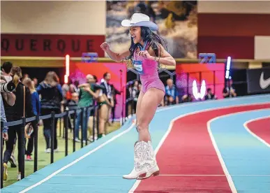  ?? ROBERTO E. ROSALES/JOURNAL ?? Tara Davis Woodhall celebrates after winning the long jump Friday at the USATF Indoor Championsh­ips at the Albuquerqu­e Convention Center.