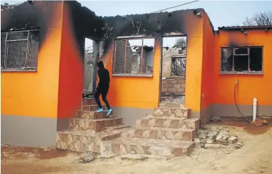  ?? /KABELO MOKOENA ?? The remains of Thandi Nhlapo’s house in Orange Farm, south of Johannesbu­rg, which was allegedly burnt by the police after her slain son Vusi shot at them.