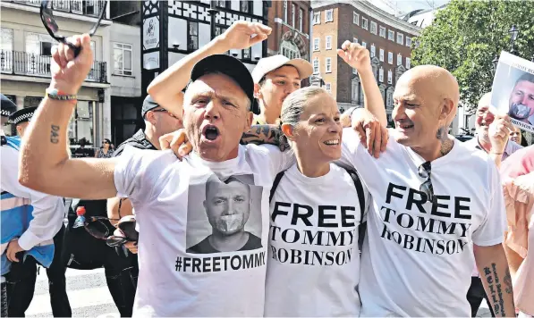  ??  ?? Supporters of Tommy Robinson gathered outside the Court of Appeal in London and applauded when the decision was announced; Mr Robinson, below, was released from prison pending a new trial for contempt of court